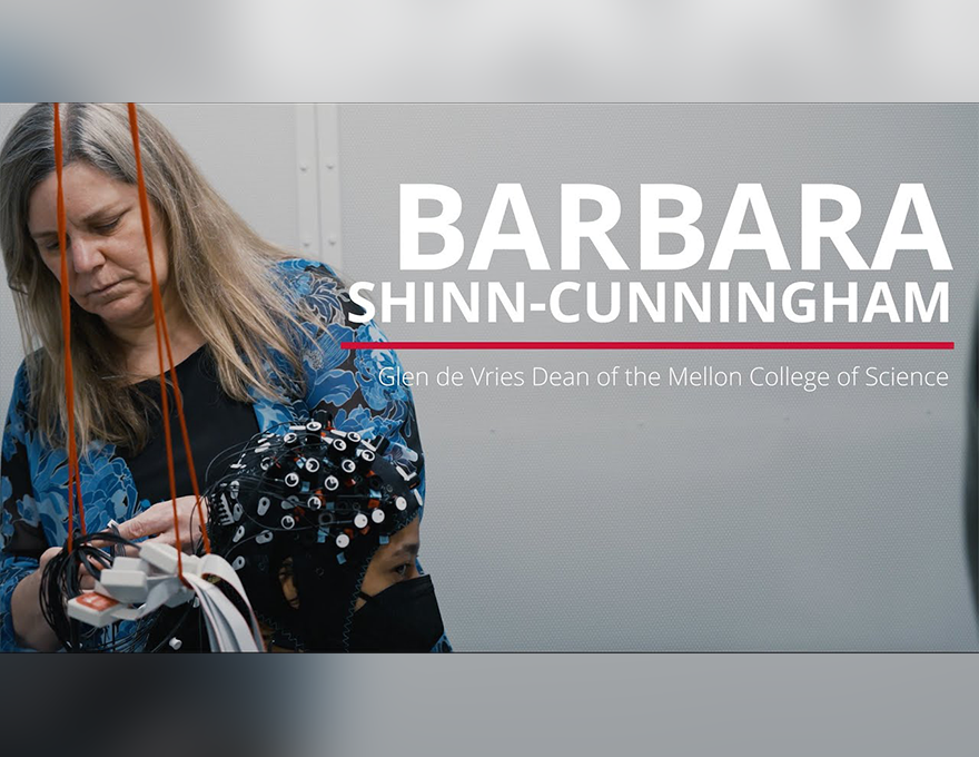 A woman handles wires attached to a participant's mesh cap. On the right are the words, "Barbara Shinn-Cunningham: Glen de Vries Dean of the Mellon College of Science.
