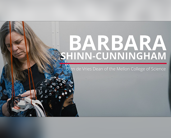 A woman handles wires attached to a participant's mesh cap. On the right are the words, "Barbara Shinn-Cunningham: Glen de Vries Dean of the Mellon College of Science.